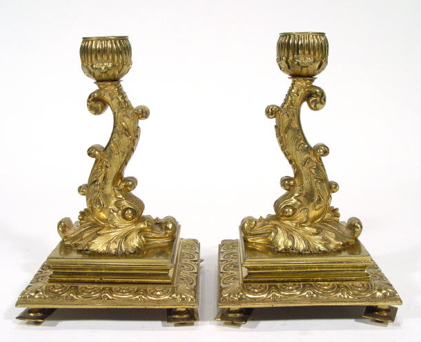 Appraisal: Pair of square based gilt brass Victorian candlesticks modelled as