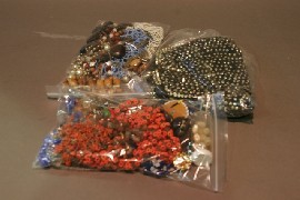 Appraisal: Two bags of beaded necklaces together with a hand bag