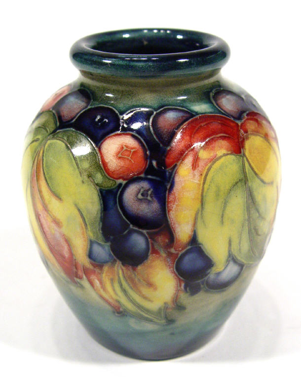 Appraisal: Early miniature Moorcroft pottery vase hand painted and tubelined with