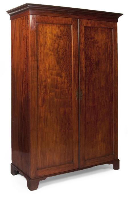 Appraisal: A th century mahogany wardrobe the projected moulded cornice over