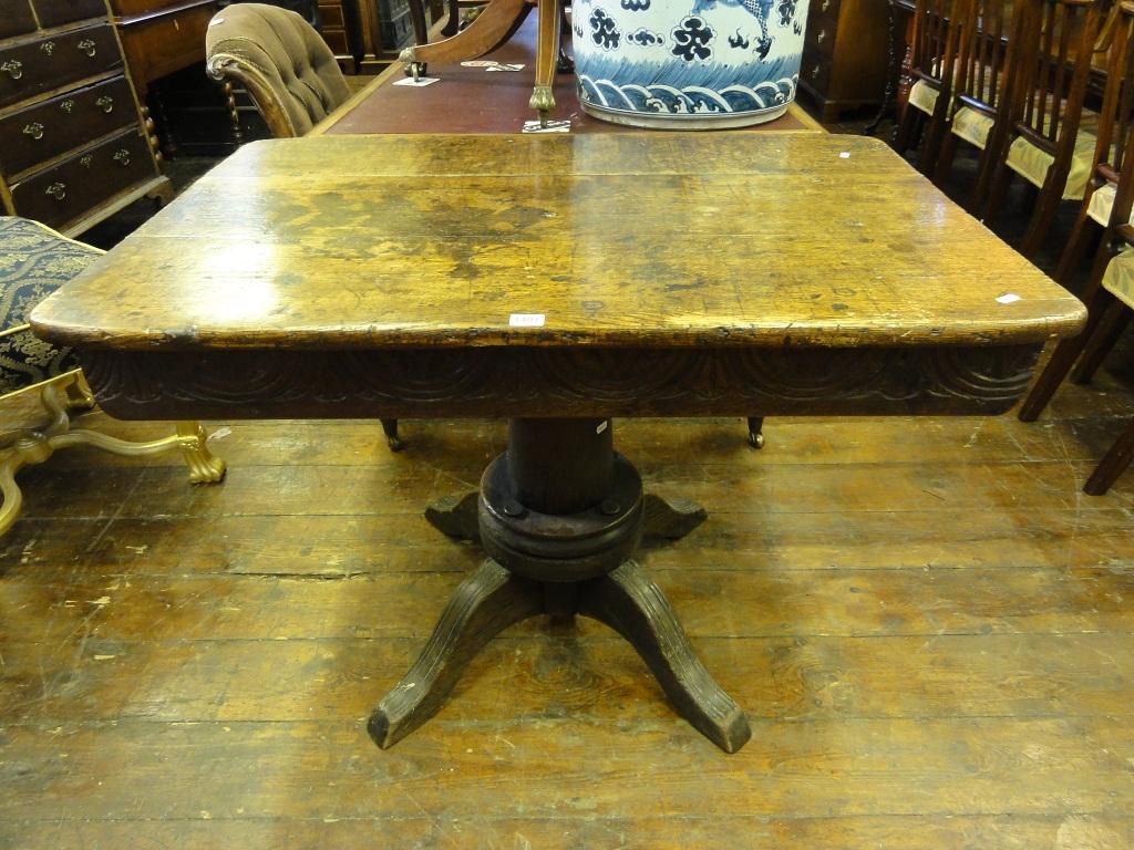 Appraisal: An antique oak side centre table the rectangular boarded top