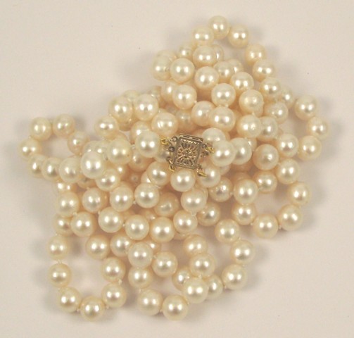 Appraisal: THREE STRING PEARL NECKLACE strung with well matched white pearls