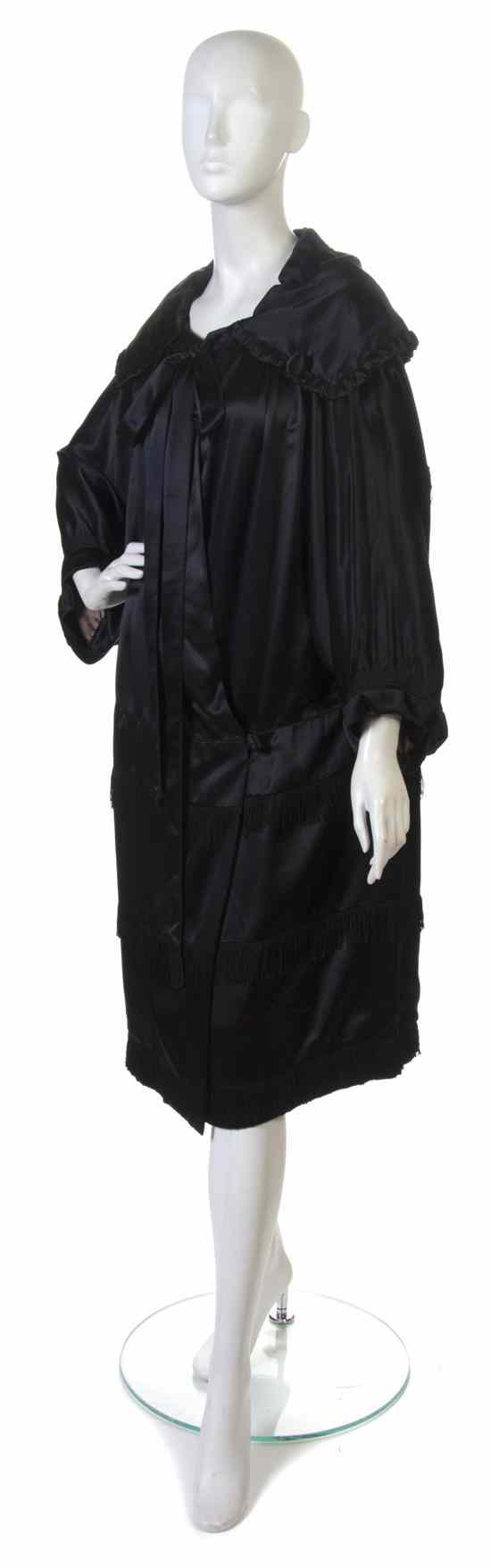 Appraisal: A Black Satin Evening Coat with fringe detail Labeled Jay's