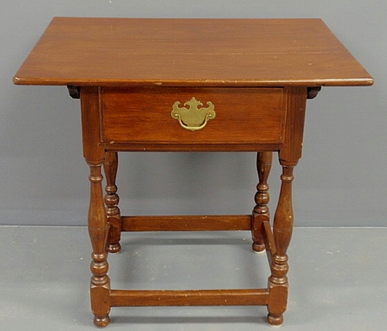 Appraisal: Pennsylvania walnut tavern table with batten top single drawer turned