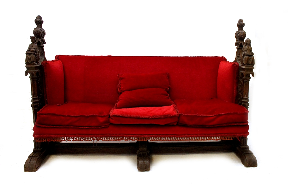 Appraisal: A th century oak Gothic Revival and later sofa on