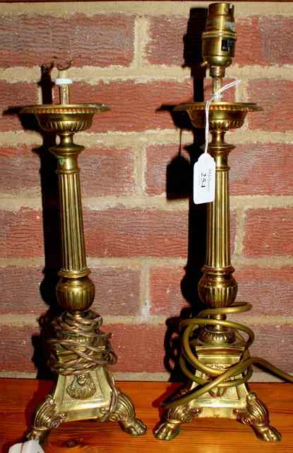 Appraisal: A PAIR OF ITALIANATE BRASS TABLE LAMPS each with reeded