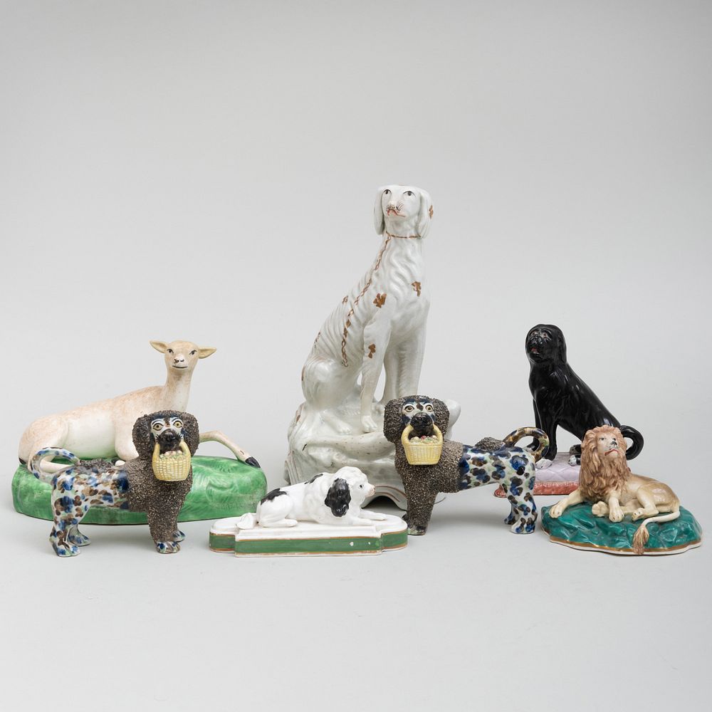 Appraisal: Group of Staffordshire Dogs and a Fawn The dogs comprising