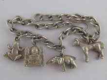 Appraisal: A white metal tests silver charm bracelet approx cm long