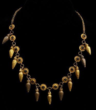 Appraisal: EARLY PERSIAN GOLD AND GARNET NECKLACE WITH RIBBED AMPHORA PENDANTS