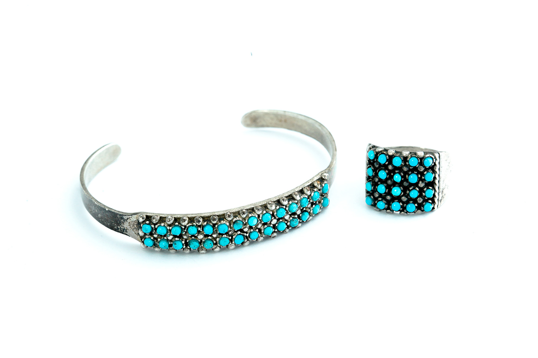 Appraisal: AMERICAN INDIAN SILVER AND PETIT POINT TURQUOISE RING AND BRACELET