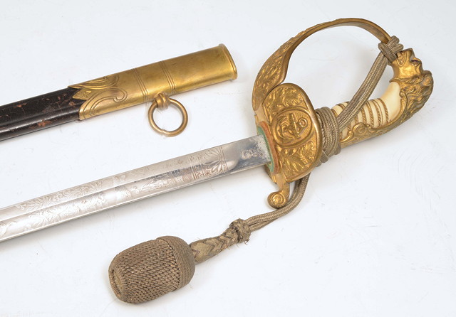 Appraisal: A GERMAN NAVAL OFFICERS DRESS SWORD the engraved blade stamped