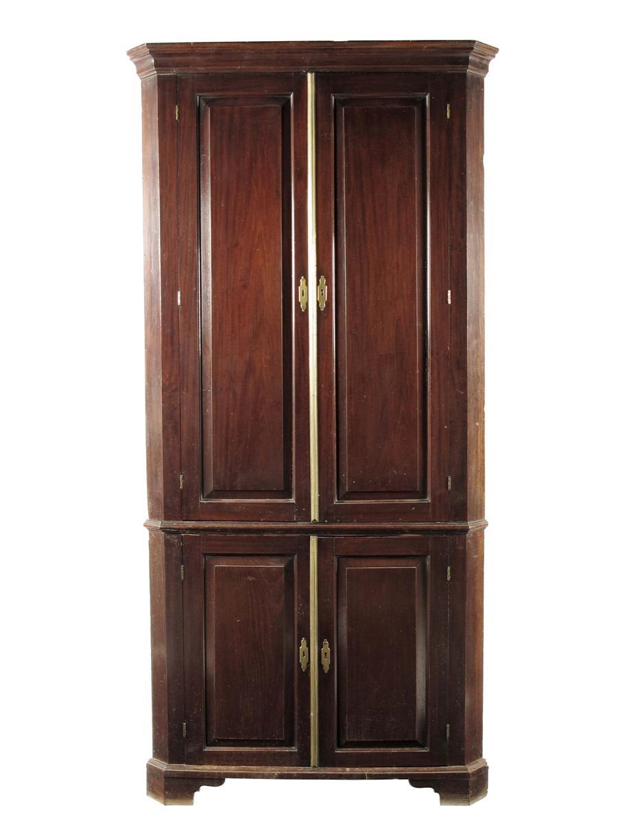 Appraisal: A George II mahogany standing corner cupboard