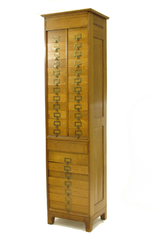 Appraisal: AN UNUSUAL OAK LETTER FILE CABINET American c The tall