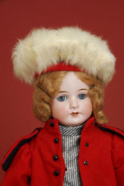 Appraisal: Schoneau Hoffmeister Child in Red Coat Germany ca bisque socket