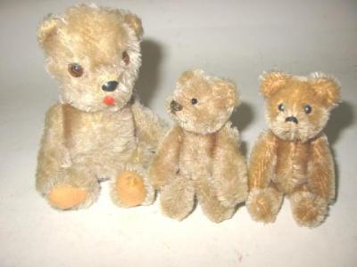 Appraisal: A Schuco miniature teddy covered in beige plush with black