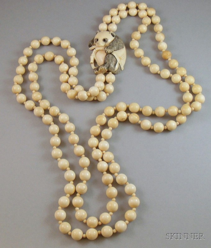 Appraisal: Asian Double-strand Ivory Beaded Necklace with Panda and Bamboo Pendant