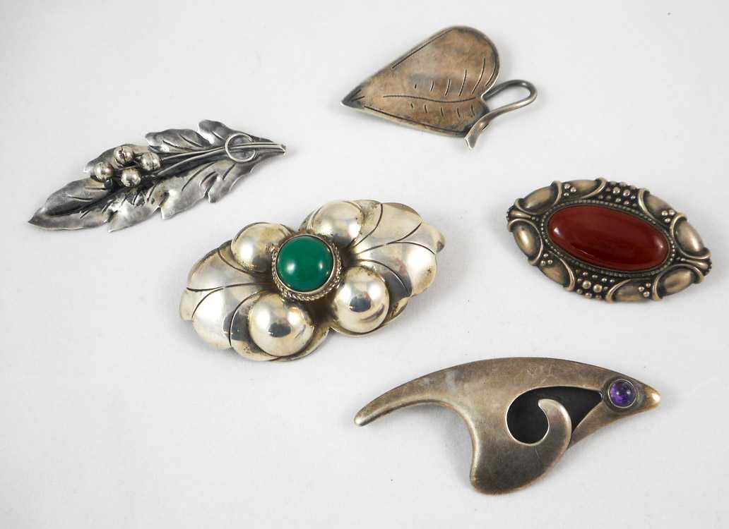 Appraisal: COLLECTION OF FIVE SILVER BROOCHES including a - L brooch