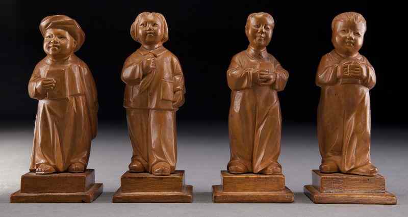 Appraisal: Chinese Cultural Revolution boxwood carvingsdepicting children holding books Tallest ''H