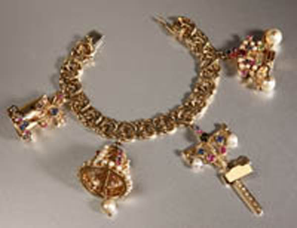 Appraisal: A gold charm bracelet A gold charm bracelet K yellow