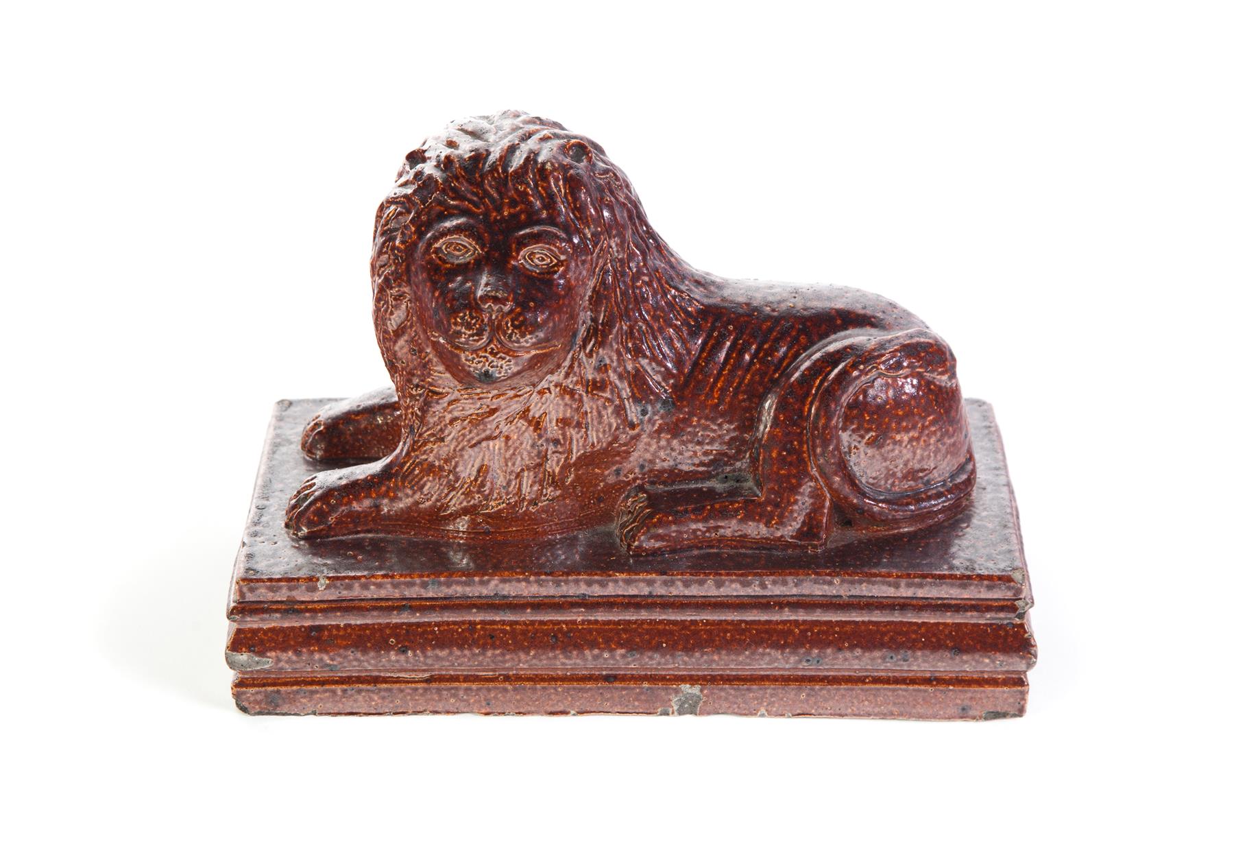 Appraisal: AMERICAN SEWERTILE LION First half- th century Molded reclining lion