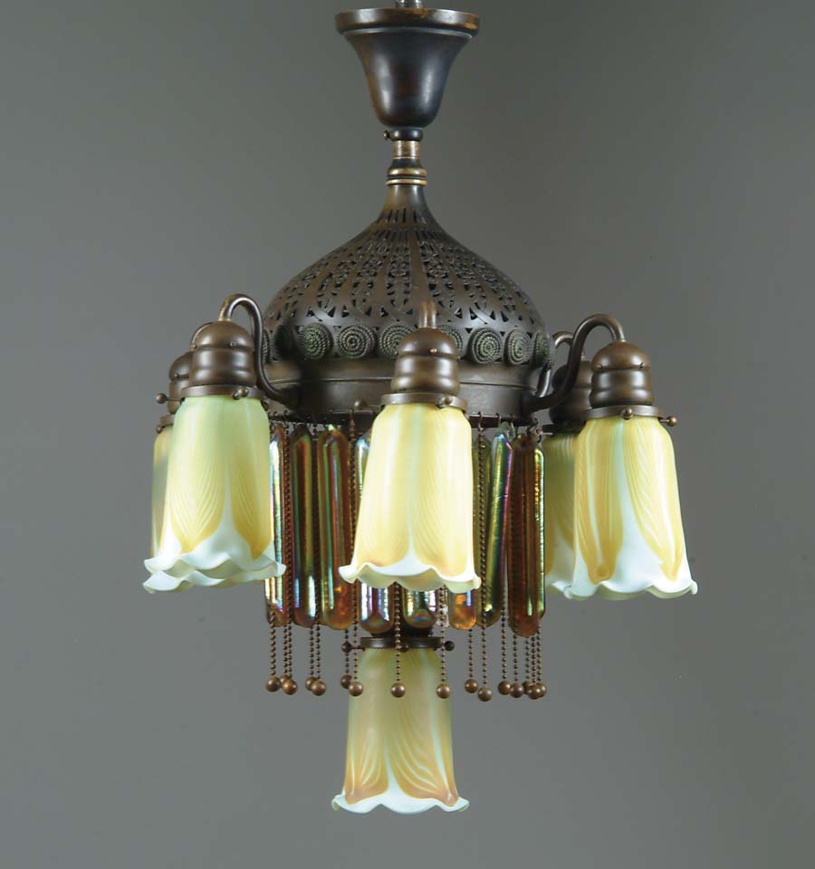 Appraisal: TIFFANY CHANDELIER Gorgeous -lite Tiffany chandelier has pierced bronze fixture