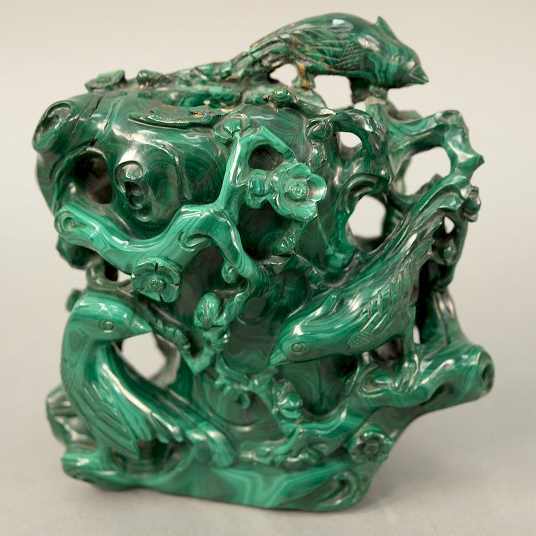 Appraisal: Malachite tree trunk vase having carved scrolling flowering branches with