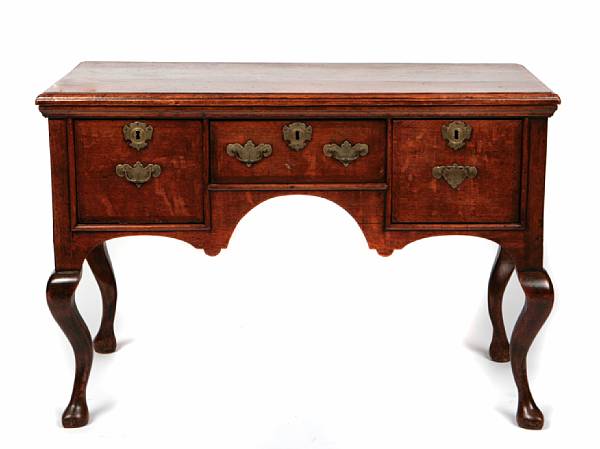 Appraisal: A George I oak lowboy fitted with three drawers on