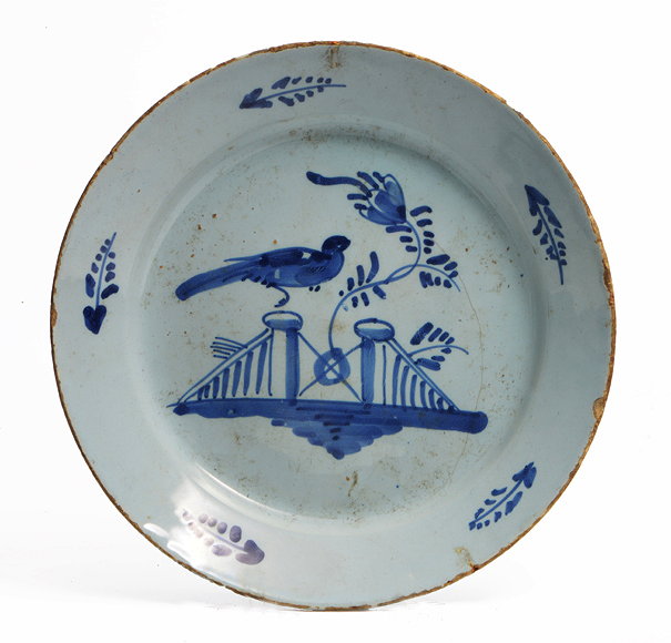 Appraisal: A GEORGE III BRISTOL DELFTWARE PLATE decorated with a bird