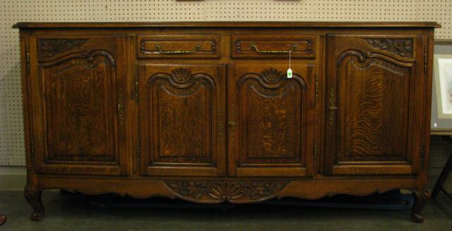 Appraisal: Country French Carved Sideboard with raised panel doors and drawer