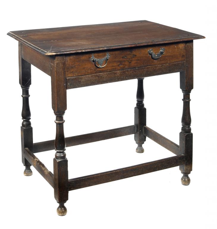 Appraisal: A GEORGE II JOINED OAK TABLE the oversailing boarded top