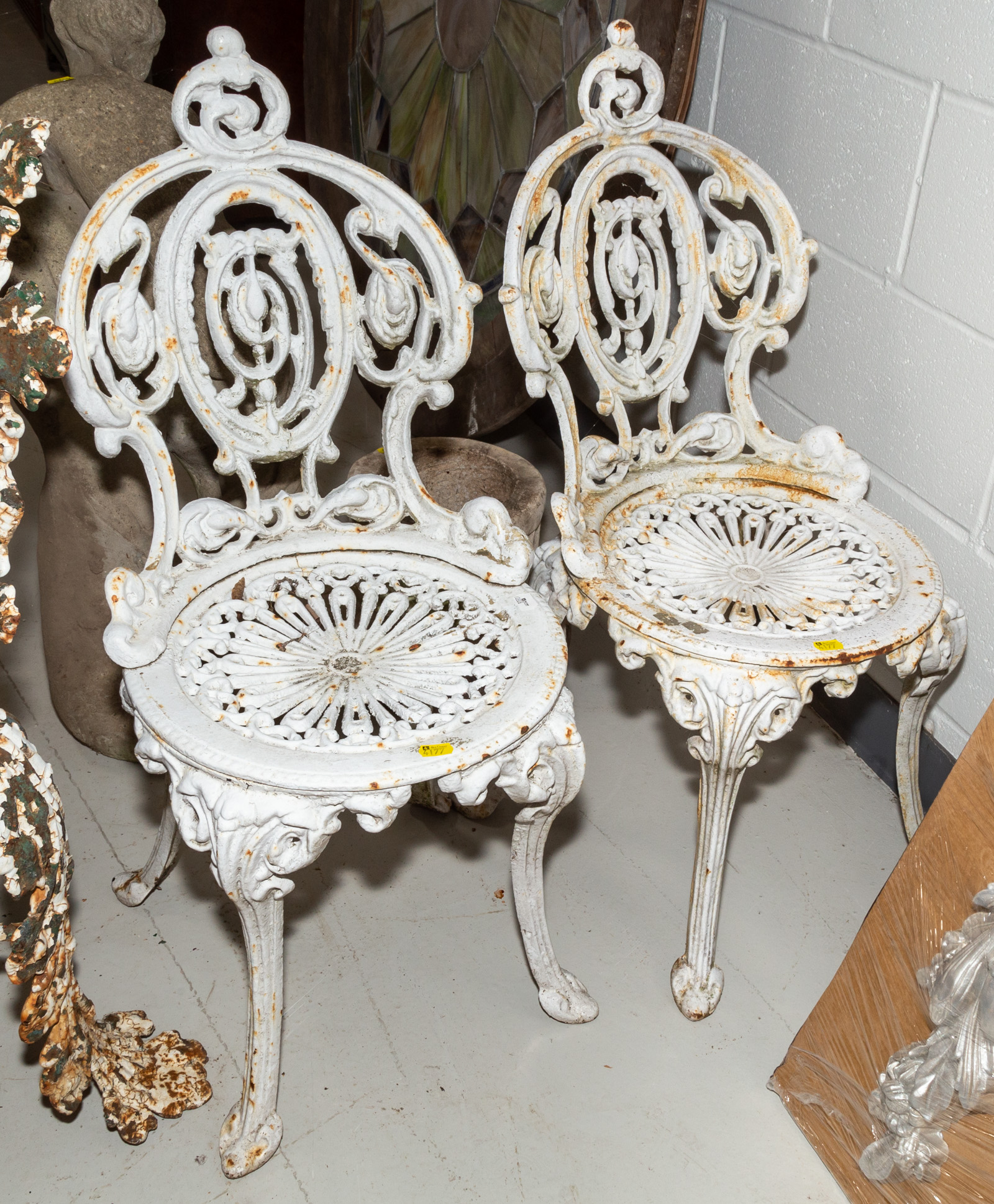 Appraisal: A PAIR OF ROCOCO STYLE CAST IRON GARDEN CHAIRS Late