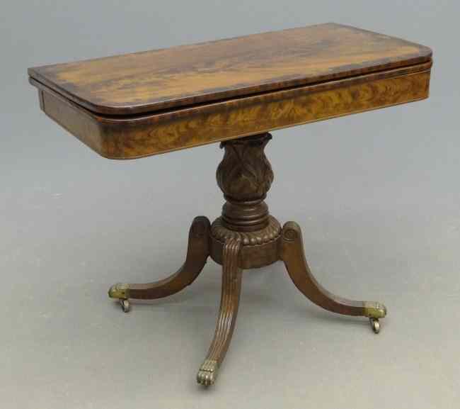 Appraisal: th c mahogany reeded leg card table Feet end in