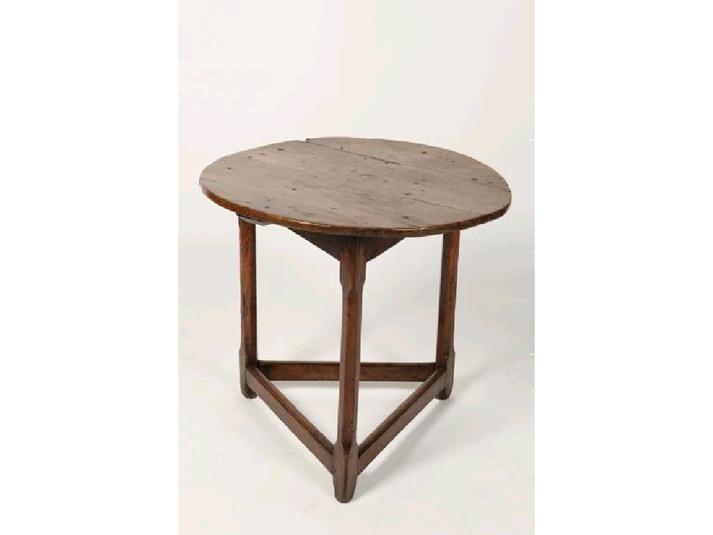 Appraisal: A GEORGE III ELM CRICKET TABLE the circular top on