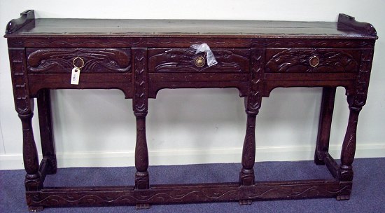 Appraisal: A late th Century oak dresser carved at a later