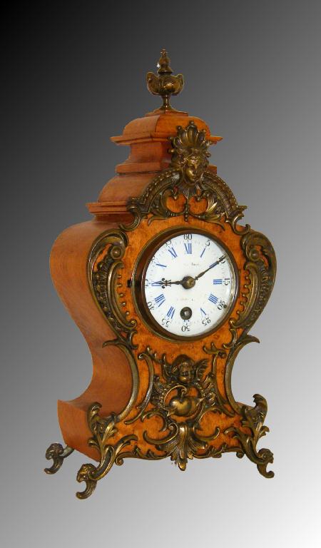 Appraisal: Small French walnut mantel timepiece with Lenzkirch movement the porcelain