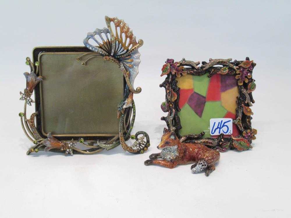 Appraisal: TWO JAY STRONGWATER PICTURE FRAMES of cast metal hand enameled