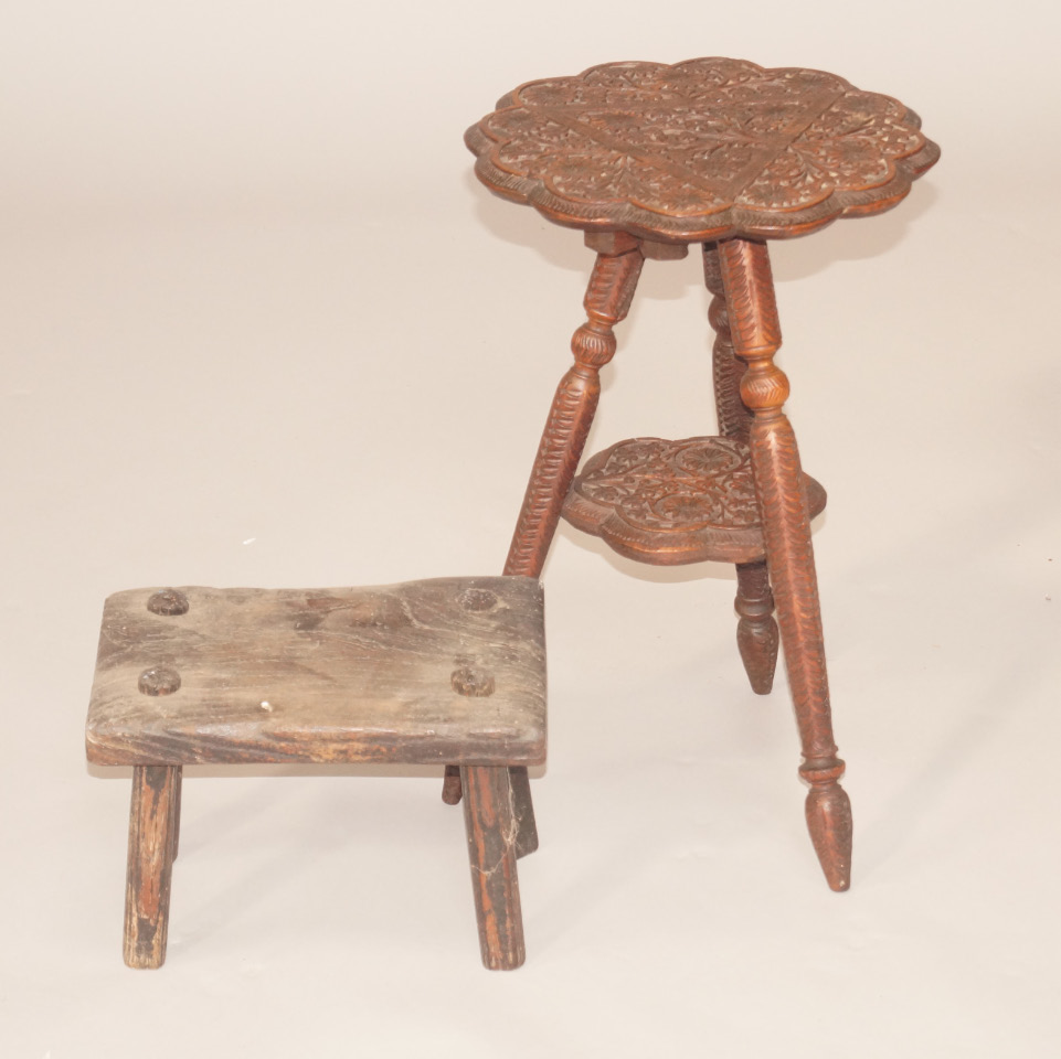 Appraisal: A Burmese carved hardwood two tier occasional table decorated with