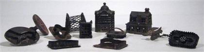 Appraisal: Group of iron banks and cookie cutters th century Comprising