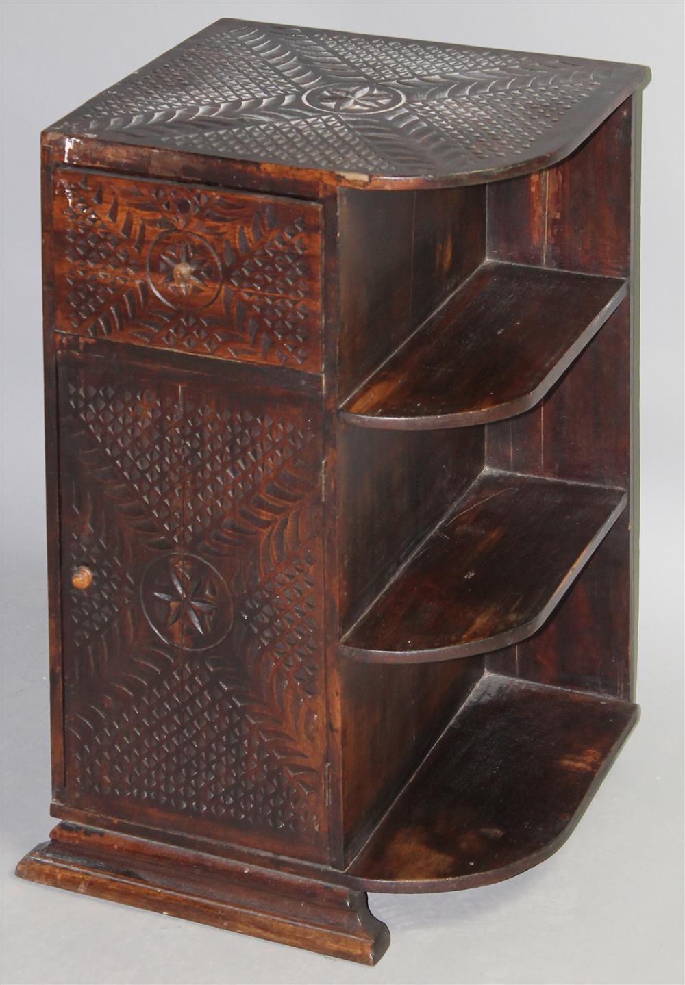 Appraisal: TRAMP ART CARVED SIDE TABLE having a carved rectangular top