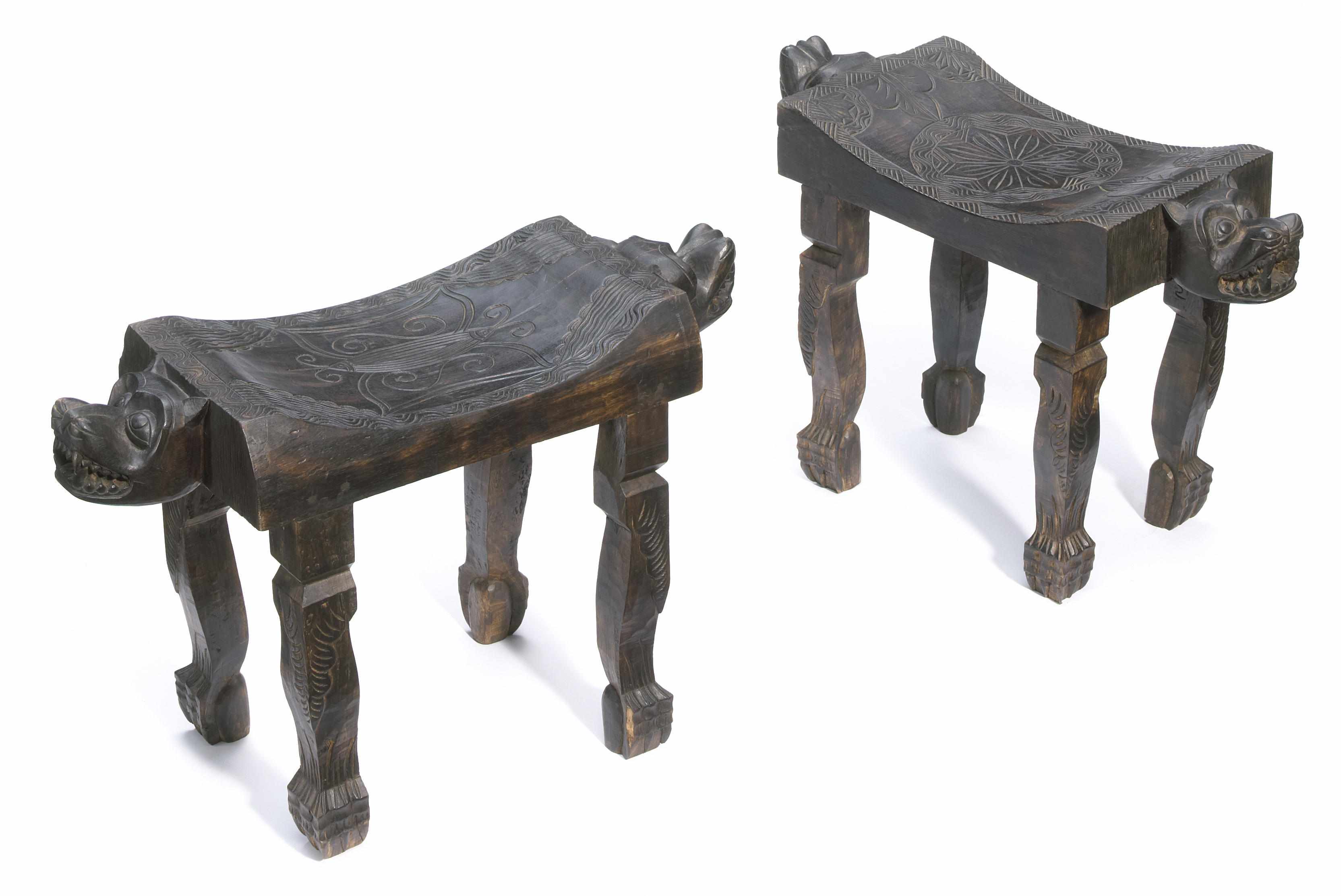 Appraisal: A pair of West African carved hardwood stools th Centurywith