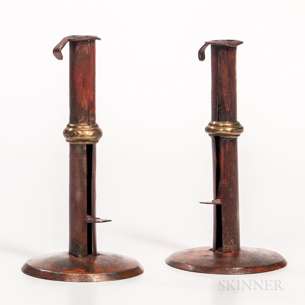 Appraisal: Two Red-painted Brass-banded Iron Hogscraper Candlesticks Two Red-painted Brass-banded Iron