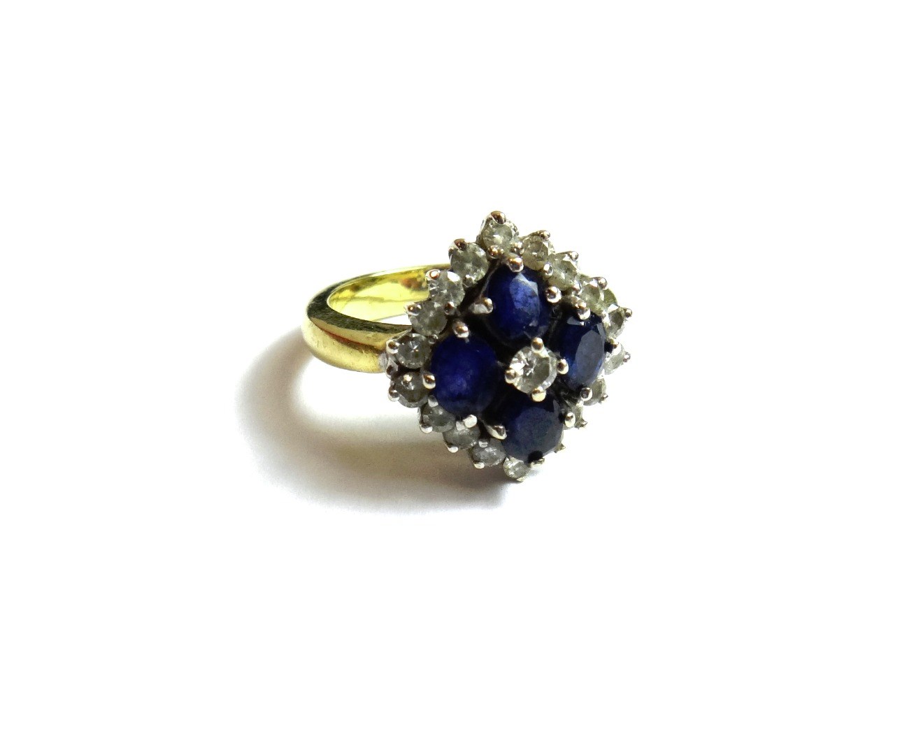 Appraisal: A gold sapphire and diamond set cluster ring mounted with