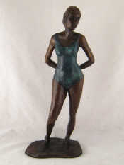 Appraisal: A bronze figure of a standing woman in a bathing