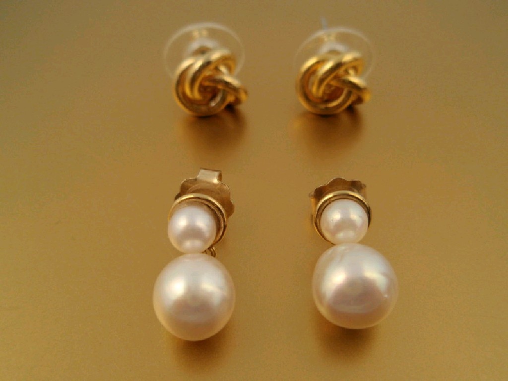 Appraisal: A pair of pearl drop earrings and a pair of