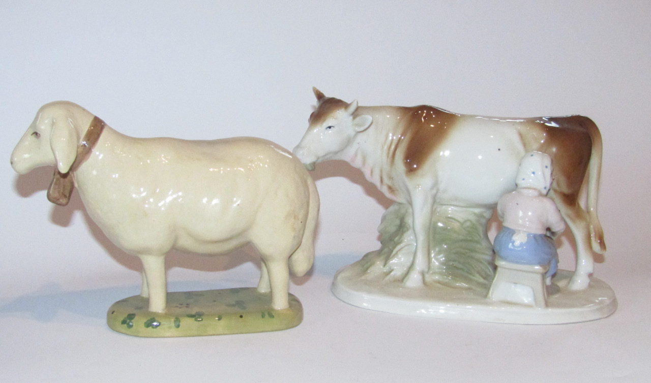 Appraisal: A GDR WA Blue Crown figure of milkmaid and cow