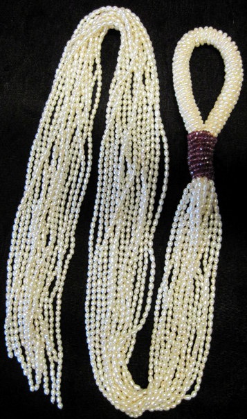 Appraisal: Multi strand pearl lariatLoop form featuring tourmaline bead accenting