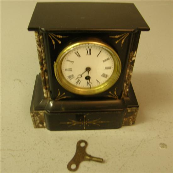 Appraisal: th century polished slate and pink marble mantel clock with