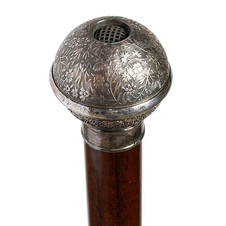 Appraisal: Pomander Silver System Cane A half open fret silver handle