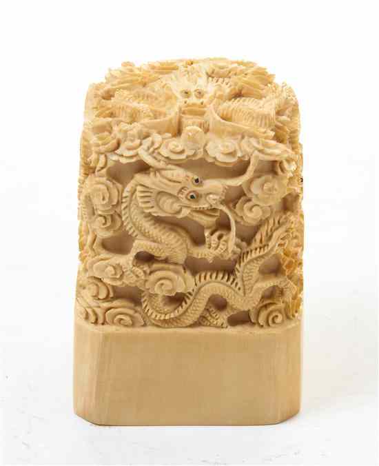 Appraisal: A Carved Ivory Seal Stamp depicting multiple writhing dragons amidst