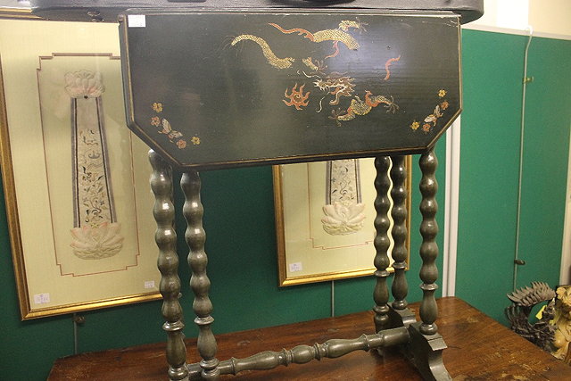 Appraisal: AN EDWARDIAN BLACK CHINOISERIE SUTHERLAND TABLE on bobbin supports and